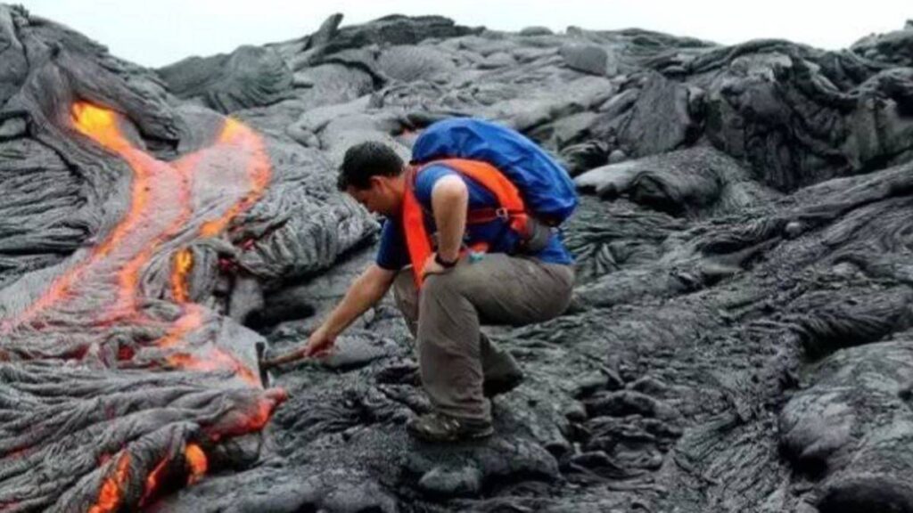 A Geologist Examining a Volcano Site
