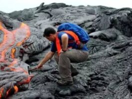 A Geologist Examining a Volcano Site
