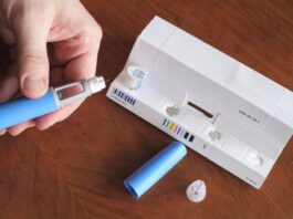 A user unboxing an Ozempic kit