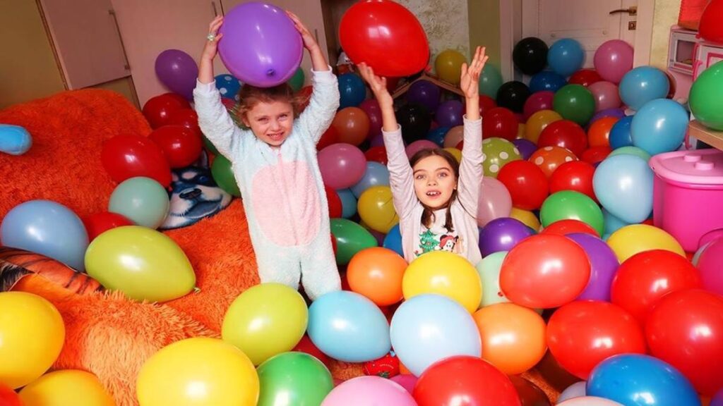 Kids playing with colorful balloons
