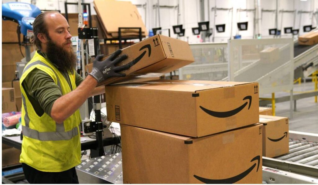 An Amazon worker in an amazon warehouse 