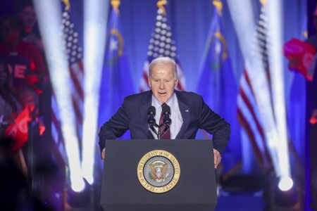 Joe Biden speaking to a crowd in a building