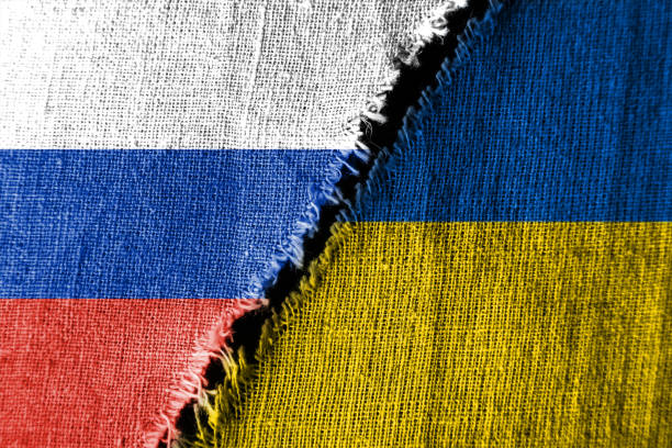 Russian and Ukrainian flags rend in the middle