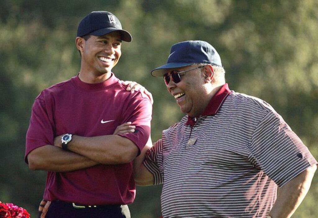 Tiger and Earl laughing during a tournament break