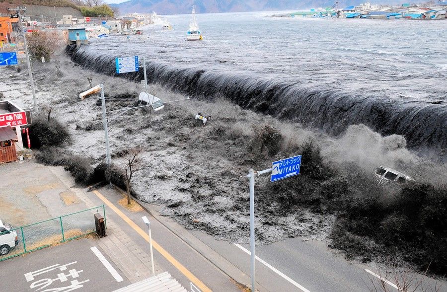 Waves of water crashing into a street