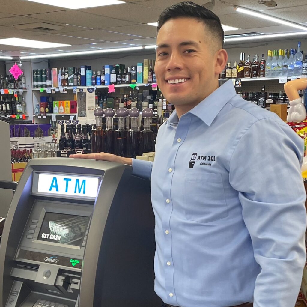 Alex with one of his machines in a liquor store.