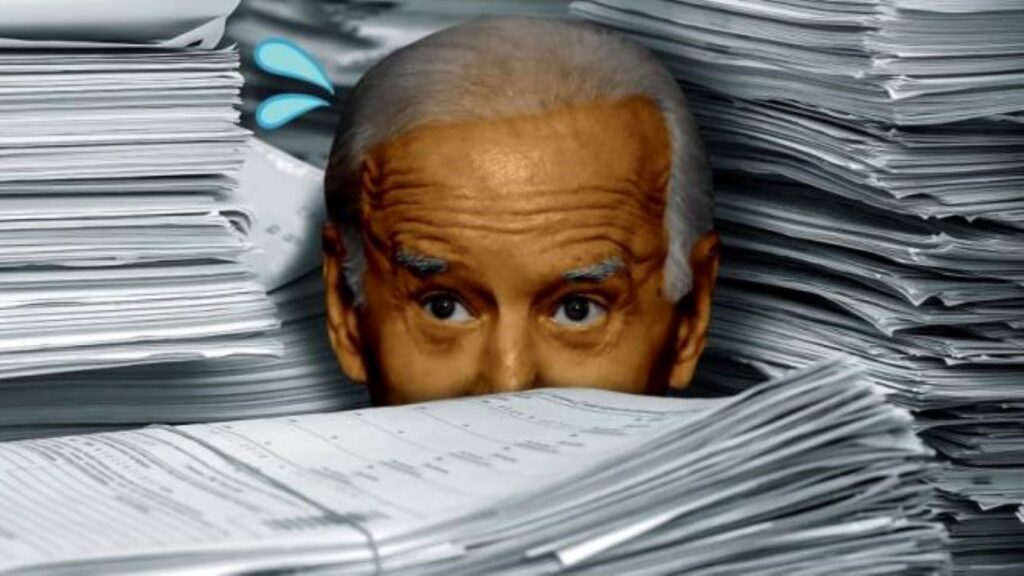An edited image of Biden drowning amid tall paper stacks