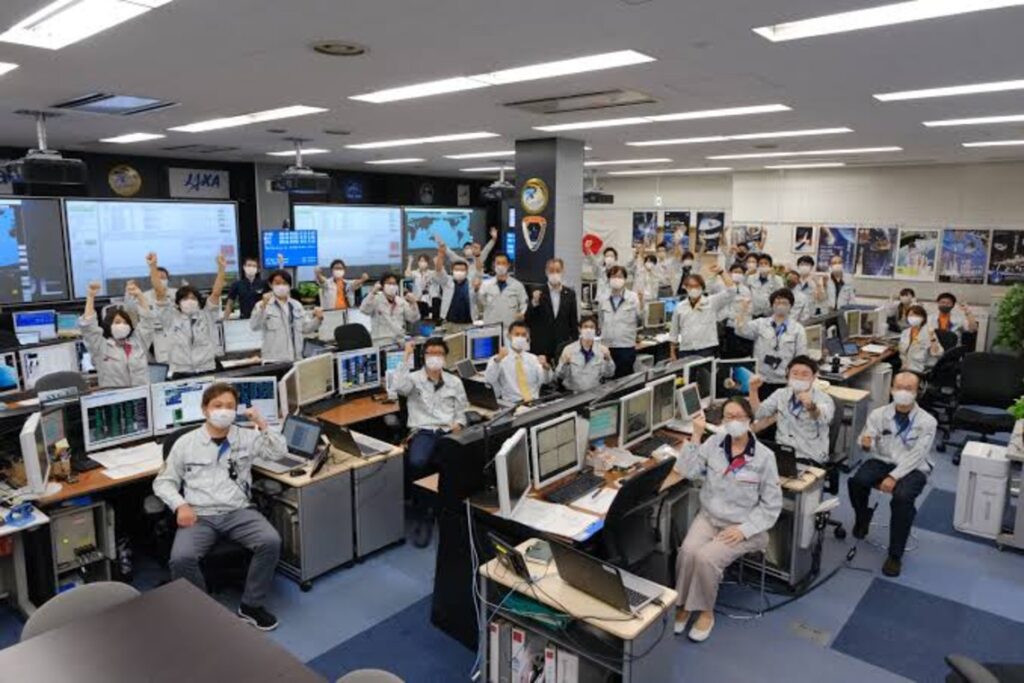 Members of the JAXA team celebrating the completion of a mission