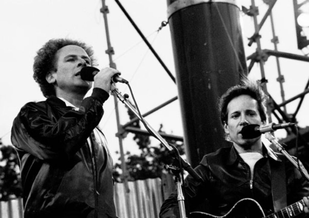 Simon & Garfunkel performing outside at a concert in Dublin