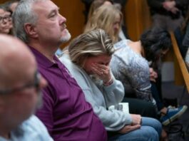 A picture of parents of the victims in court