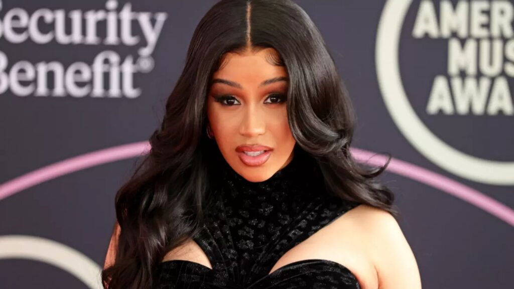 Cardi B posing for shots on a red carpet 