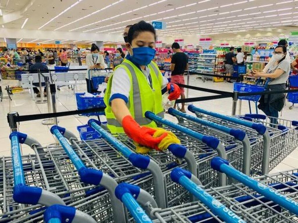 A Shopkeeper Cleaning a Trolley
