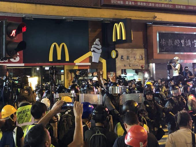Rioters and onlookers trying to access a McDonald’s outlet