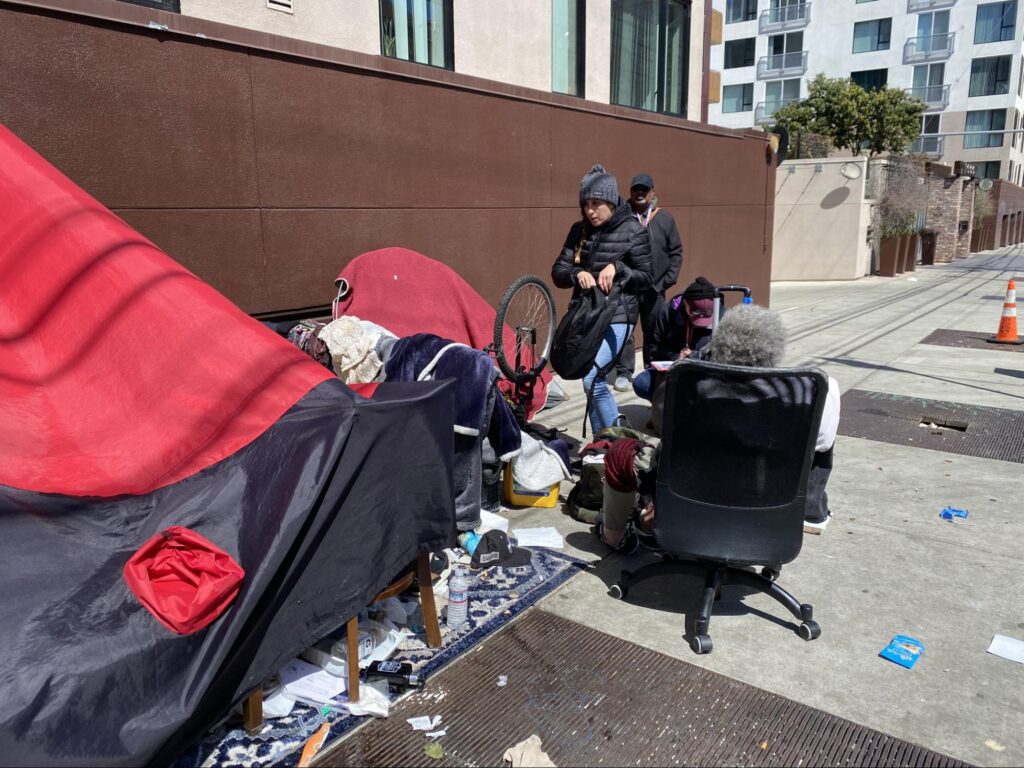 Homeless people receiving health care right on the street