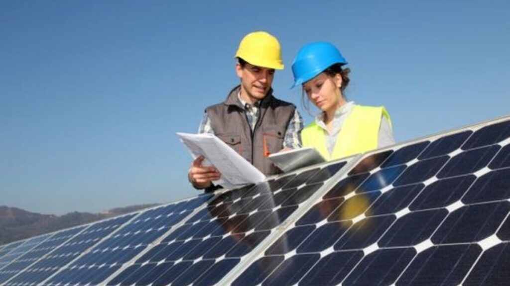 Workers installing solar panels