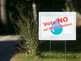 A placard that reads "Vote No on Fluoridation"