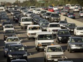 A highway filled with Gas powered Cars