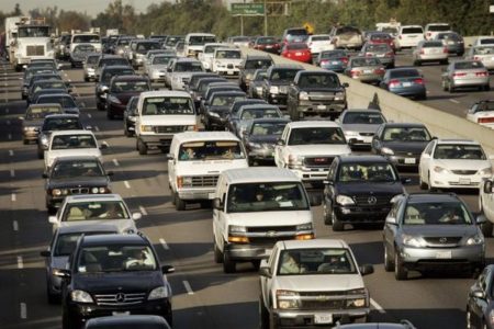 A highway filled with Gas powered Cars