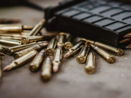 Photo of a gun and some bullets
