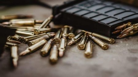 Photo of a gun and some bullets