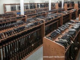 A store showing racks with various gun types