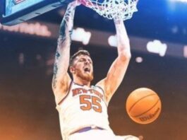 Isiah Hartenstein dunking a bsketball