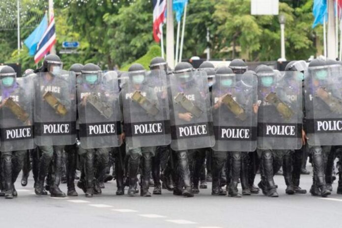 A picture of police officers during a protest.