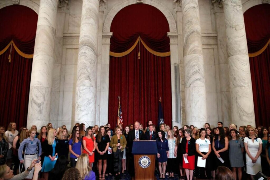 A picture of Sen. Jerry Moran, and Sen. Richard Blumenthal, D-Conn., attending a news conference with dozens of women and girls who were sexually abused by Larry Nassar.