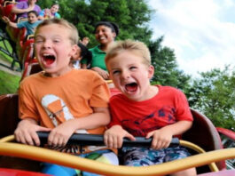Children Having fun in an amusement park ride