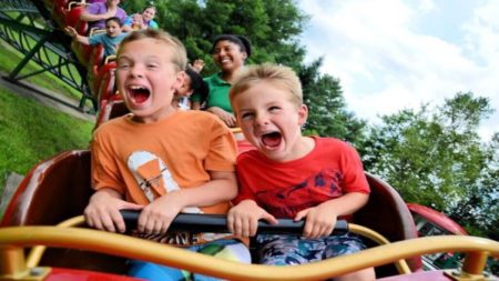 Children Having fun in an amusement park ride