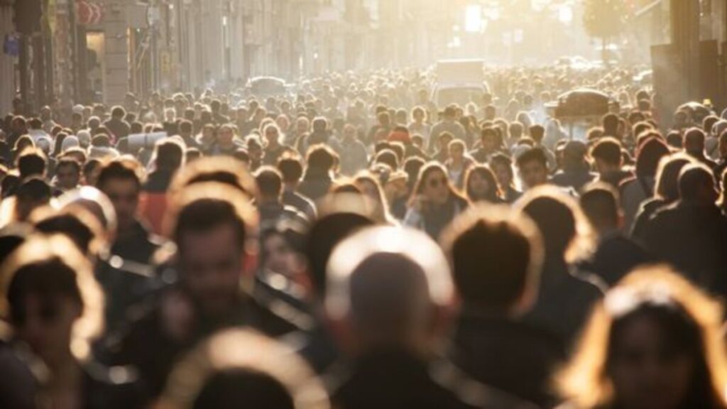 Blurred crowd of unrecognizable at the street