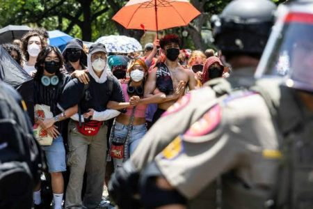 A picture of students and officers at campus protests