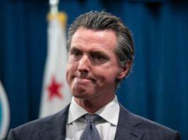 A picture of Gavin Newsom who signed the minimum wage law