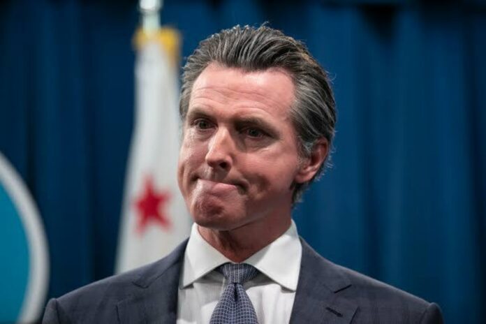 A picture of Gavin Newsom who signed the minimum wage law