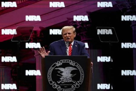 A picture of Trump at the NRA meeting