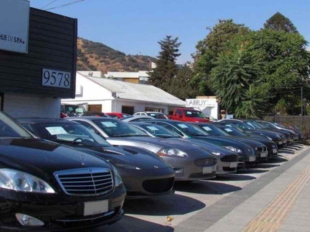 A row of cars in a parking lot