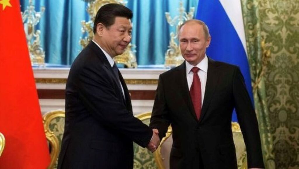 Xi Jinping and Vladimir Putin shaking hands