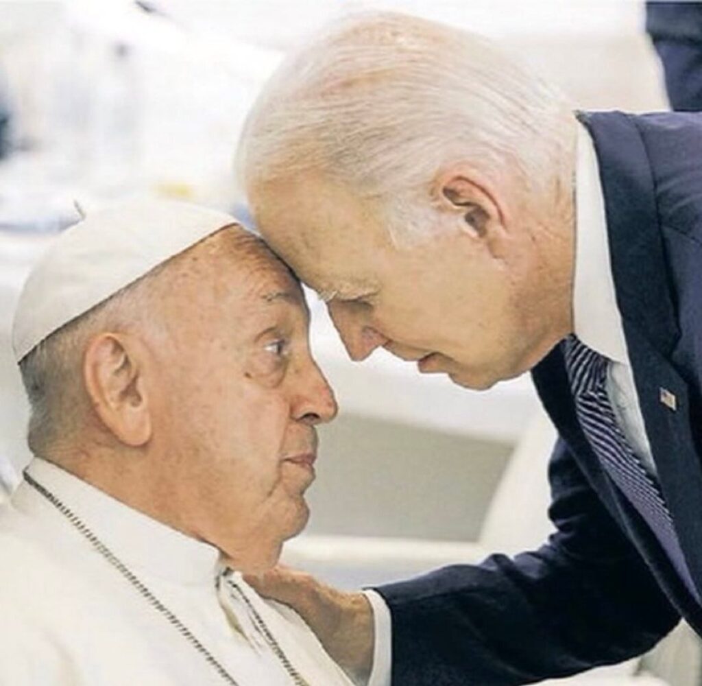 Biden and the Pope touching heads