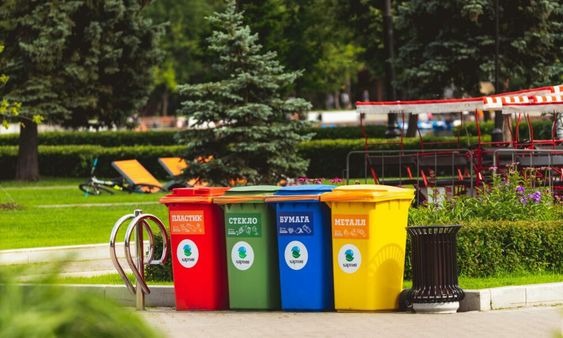 Garbage bins with different labels stacked next to each other