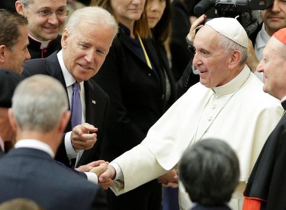 Joe Biden pointing out something to the Pope during one of their interactions