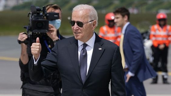 Joe Biden in a suit giving a thumbs up