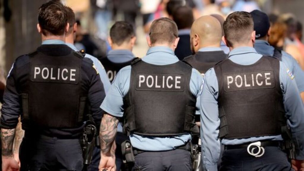 Police Officers with their backs turned