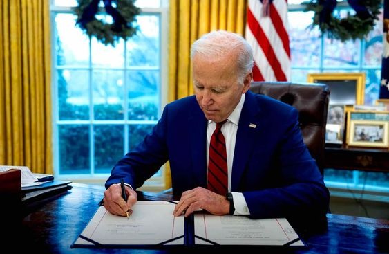 Biden signing a document