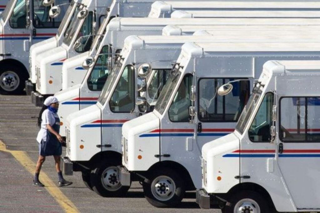 A picture of the U.S. postal service delivery trucks.