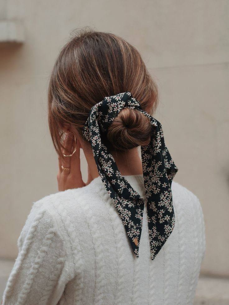 Scarf being used as a hair tie