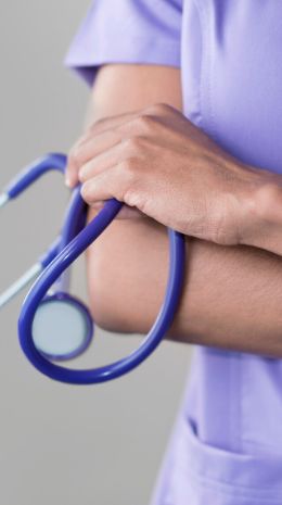 A doctor holding a stethoscope