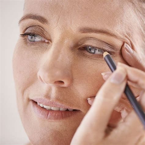 Woman applying makeup