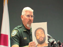 A picture of Rick Wells with a photograph of Javontee Brice.