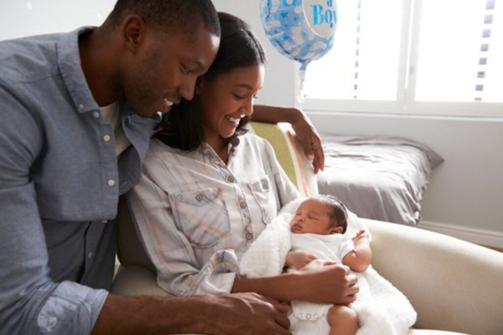 A picture of parents holding a baby