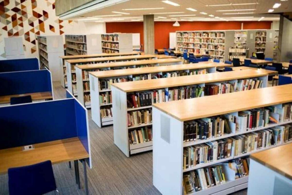 A school library filled with rows of bookshelves